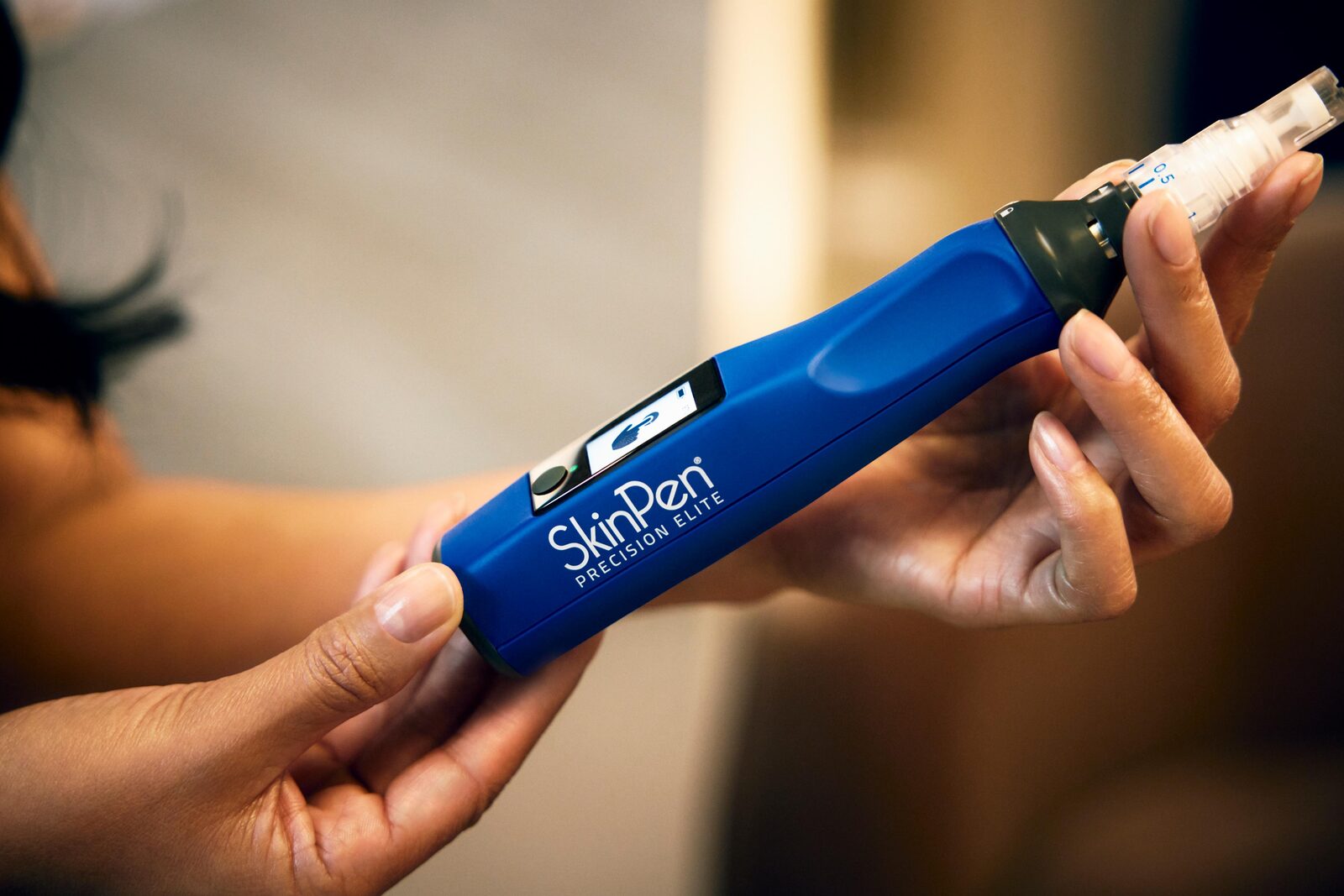 SkinPen Precision Elite device in hand